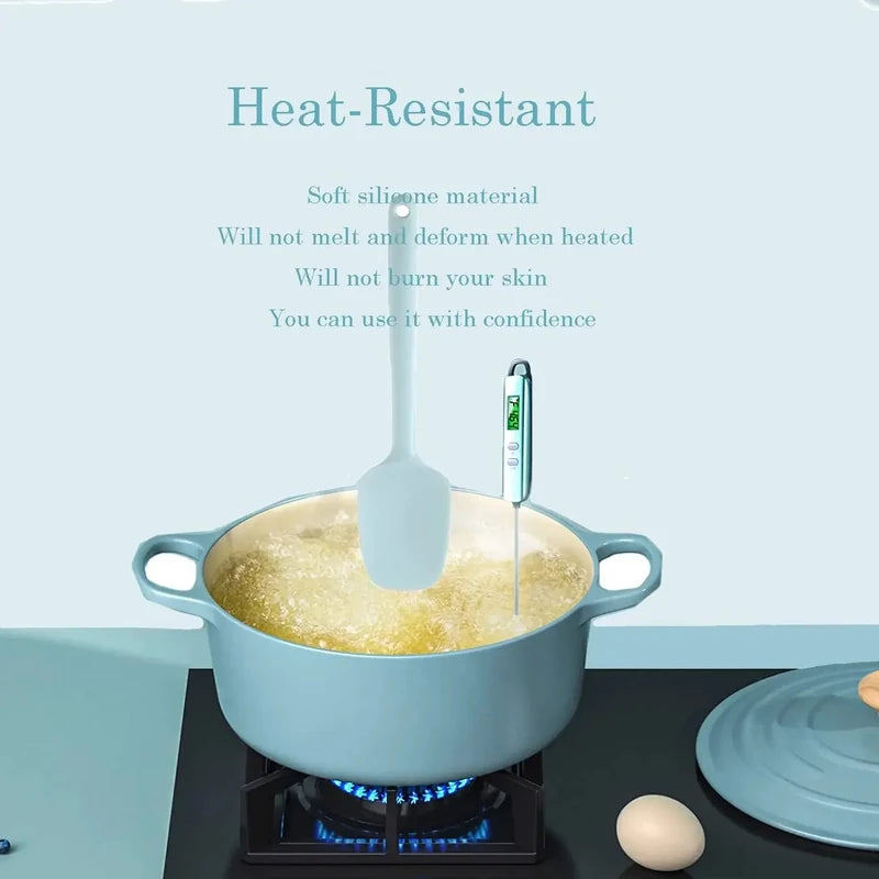 Blue pot on a stove with a spatula and thermometer, featuring text about heat-resistance.